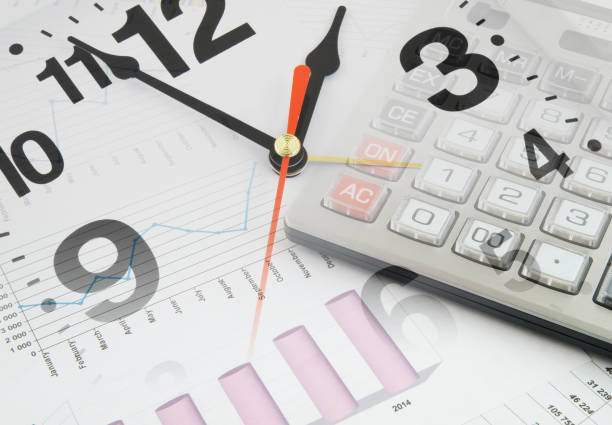 financial charts and graphs with clock and calculator - finance stock market data diagram calculator imagens e fotografias de stock