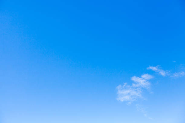 istock Group of small white clouds in blue sky, natural background photo 1203323689