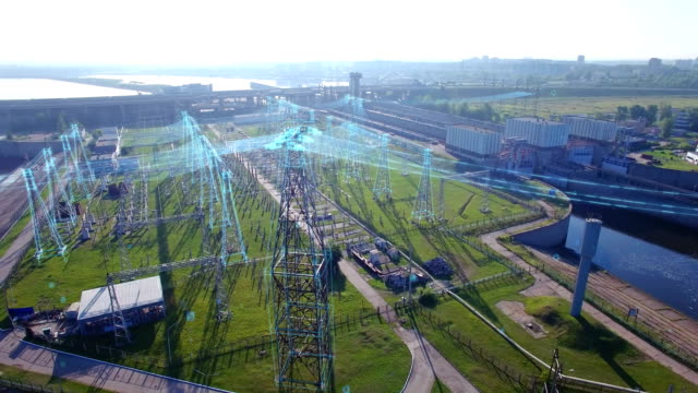 An aerial circular orbit view, high voltage electric power tower with infographic power flows, hydroelectric power station and electric substation with tall pylons and hog voltage distribution cables.