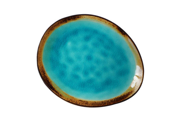 istock Empty turquoise color irregular plate isolated on white, top view 1203326770