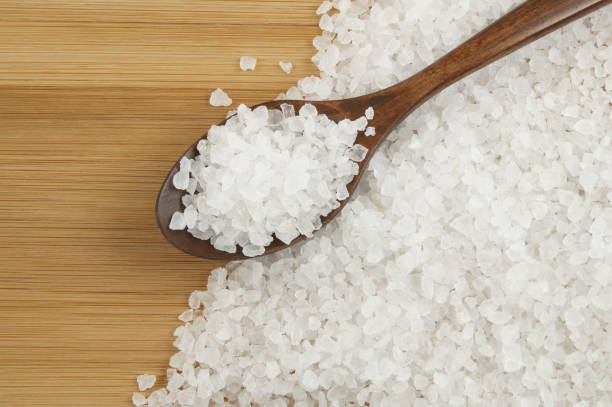 istock Salt and wooden spoon on table 1203330179