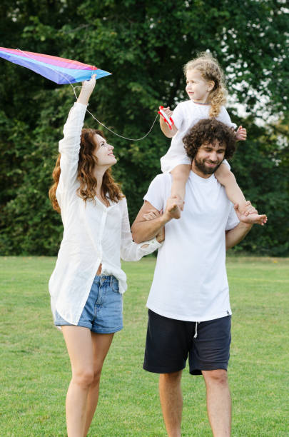 istock Happy young family in the park 1203330233