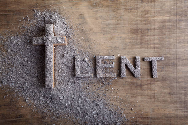 Lent word written in ash, dust as fast and abstinence period concept. Top view Lent word written in ash, dust as fast and abstinence period concept. pilgrimage photos stock pictures, royalty-free photos & images