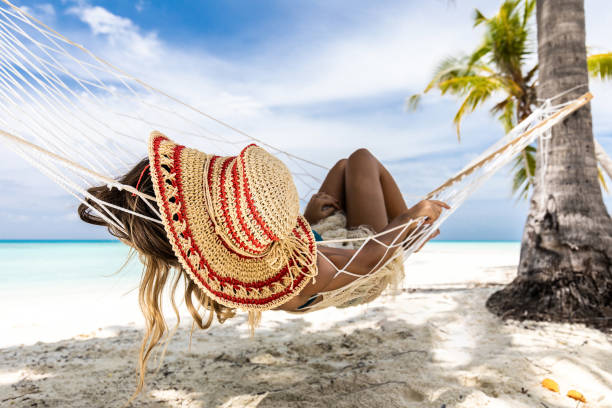 istock Relaxing in hammock on the beach! 1203331259