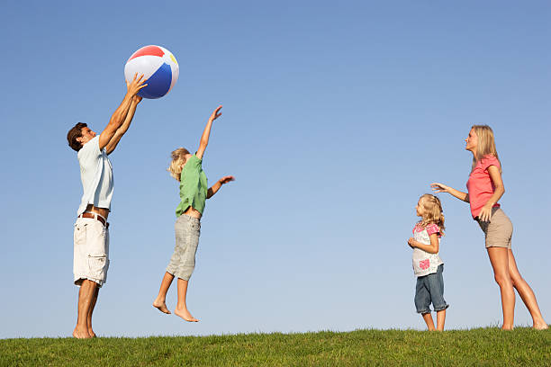 istock Young family playing in field 120333209