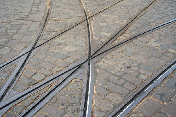 Tramway metal steel rails at city street background