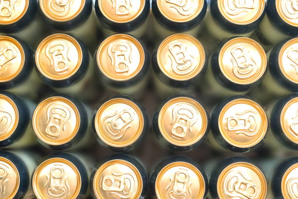istock Beer cans background is gold 1203332258