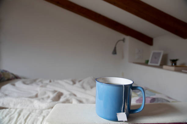 Cup of tea in the bedroom stock photo