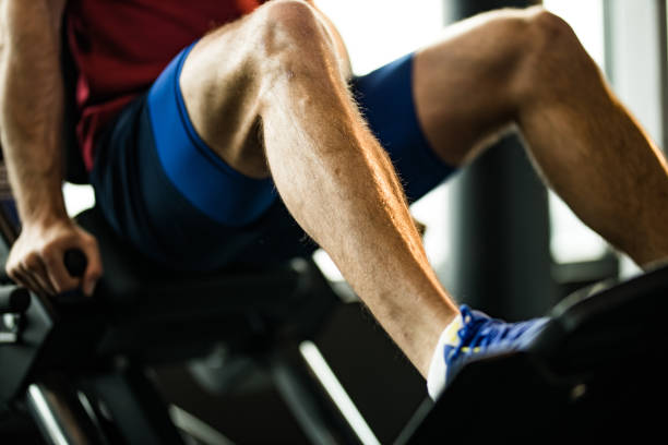 istock Unrecognizable athletic man exercising on leg press in a gym. 1203333481