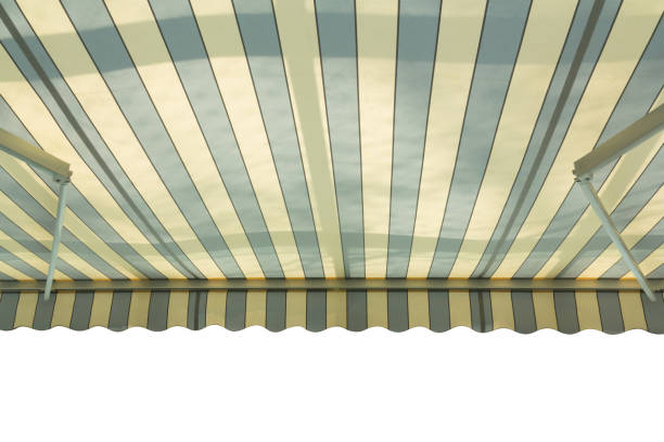 istock blue and white striped awning isolate on white background. retro canvas roof with shadow. 1203334523