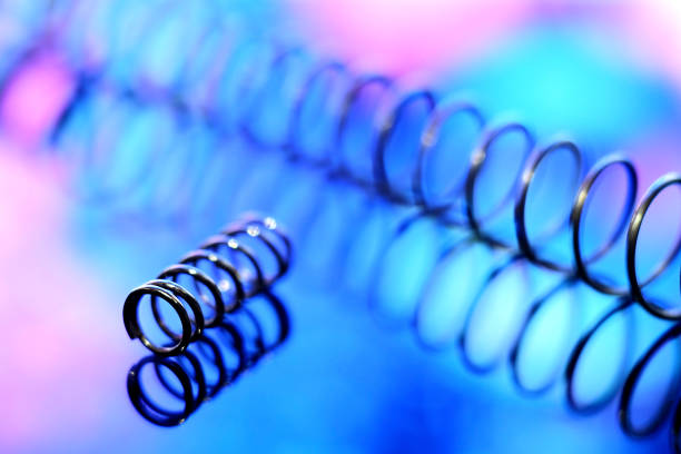 Iron spirals in blur. Shiny metal springs in blur.