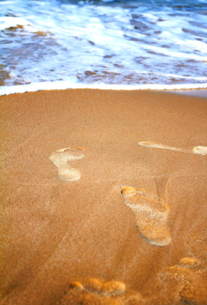 Australia, south of Perth, man walking to water.