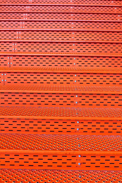 istock metallic orange staircase background texture Amsterdam 1203339286