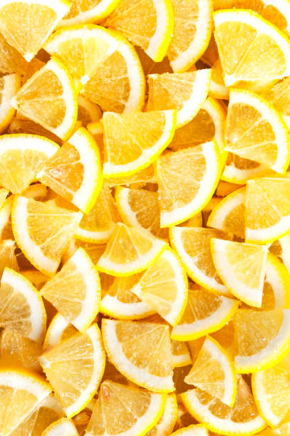 istock Slices of fresh lemon in sugar. Background and texture. 1203339441