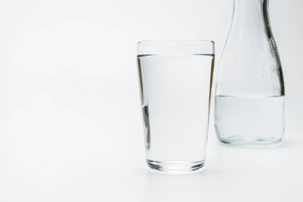 istock Glass of water isolated on white background 1203343006