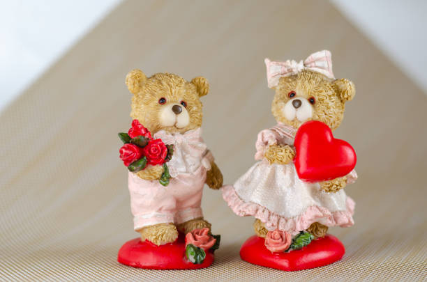 istock Two figures of lovers cubs on a light background. 1203347059