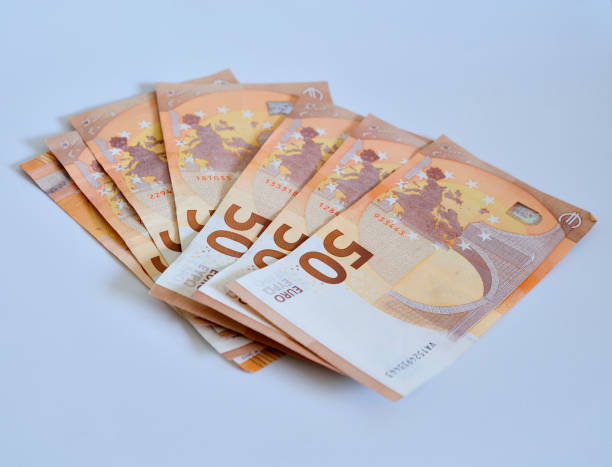 istock Money in euros on white surface. 1203350680