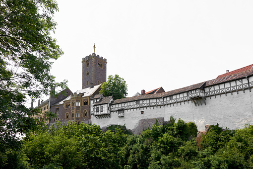 Eisenach, Germany - June 04, 2019:View of the Wartburg Castle near Eisenach in Thuringia from a hiking trail