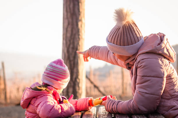 istock Mother and daughter in the park. 1203352440