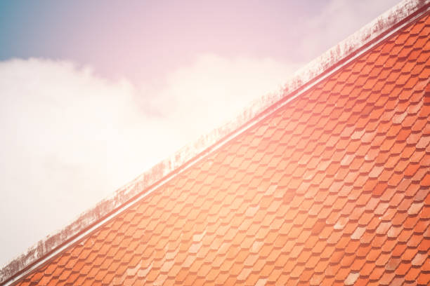 istock Tile Roof pattern background with color tone sunlight. 1203354728