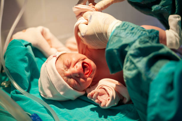 istock Newborn baby crying minutes after birth 1203356156