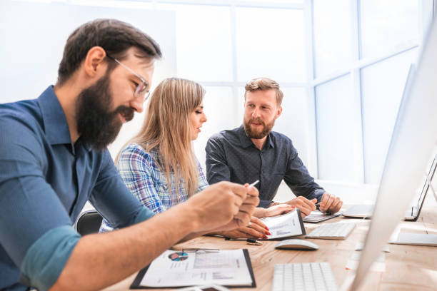 istock experts discussing financial documents at the meeting 1203358394