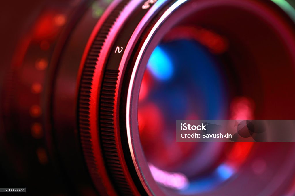 Photographic lens, close-up Photographic lens, close-up n abstract color illuminated. Movie Camera Stock Photo