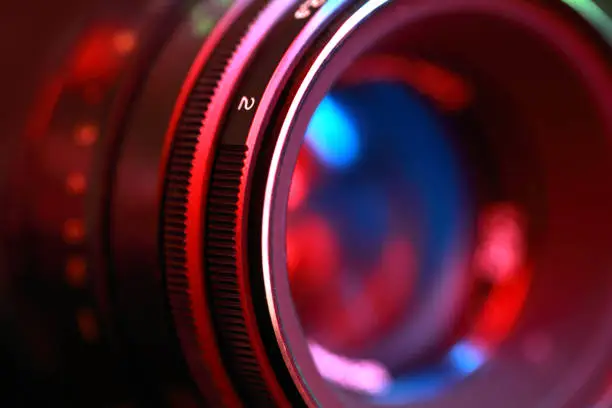 Photographic lens, close-up n abstract color illuminated.