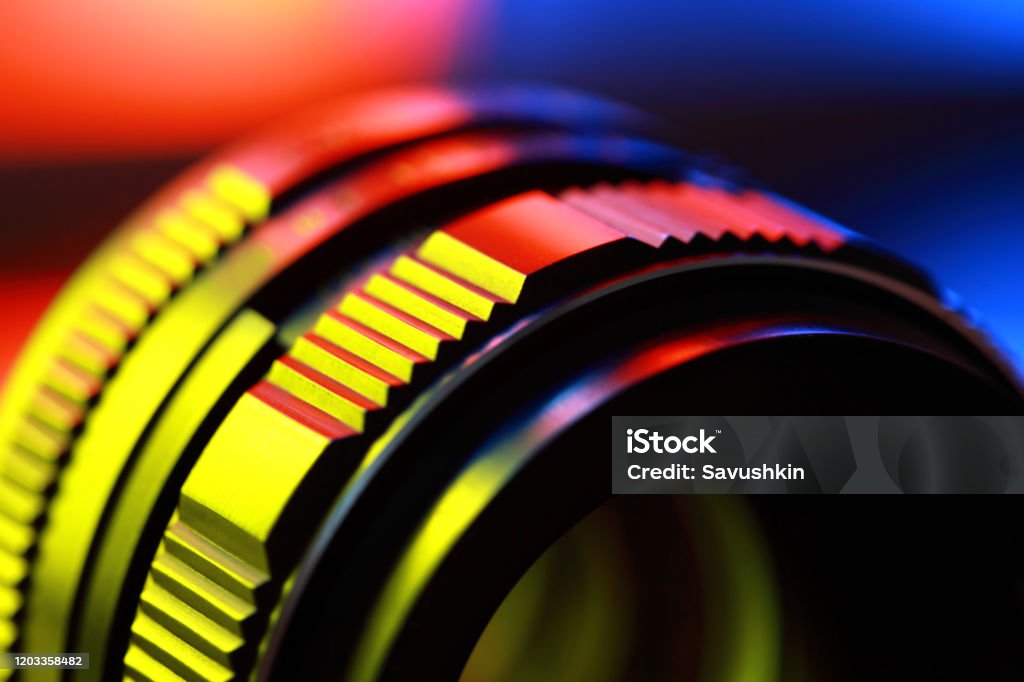 Photographic lens, close-up Photographic lens, close-up n abstract color illuminated. Movie Camera Stock Photo