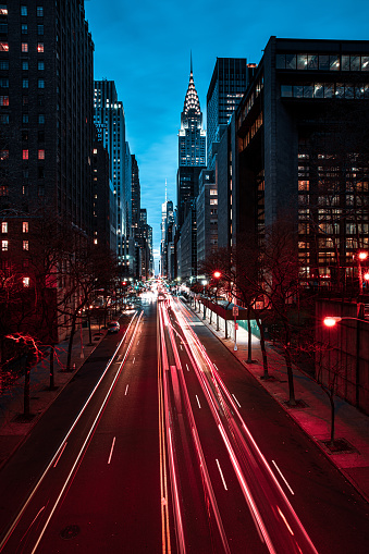 Night view of New York City midtown district  and blurred cars