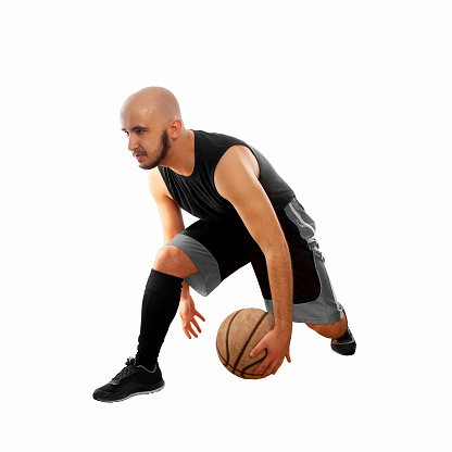 basketballer dribbles on white background. Basketball player. Basketballer on white background with copy space. Square photo.