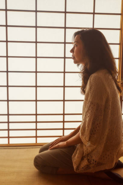 istock Woman at Japanese temple 1203361772