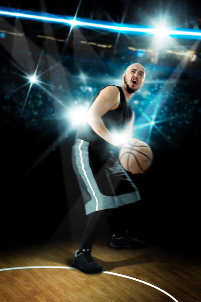 istock Basketball player throws a ball in the game. NBA game 1203361813