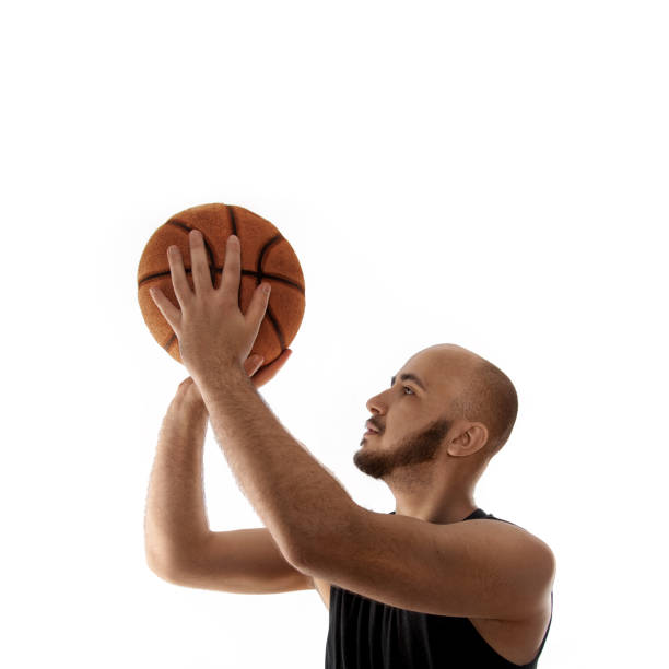 istock Basketball player shooting free throw on white background 1203361857