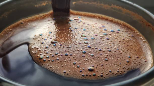 istock Coffee foam background. Coffee cup with black coffee closeup. 1203361968