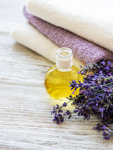 istock Lavender oil and lavender flowers 1203363398
