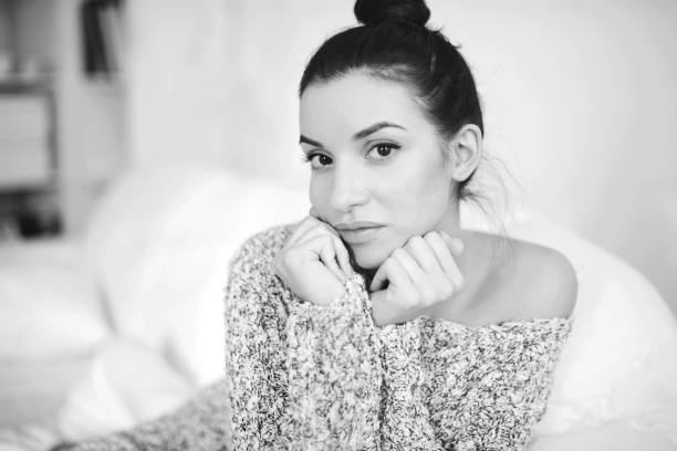 istock Young brunette woman in home interior 1203365443