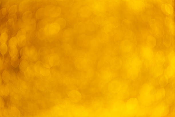 istock Gold Festive Christmas background. Elegant abstract background with bokeh defocused lights and stars 1203365627