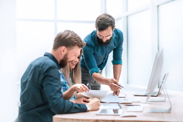 istock happy business colleagues shaking hands in the workplace 1203366686