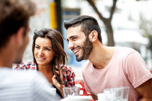 istock Young couple hanging out at a cafeteria 1203367983