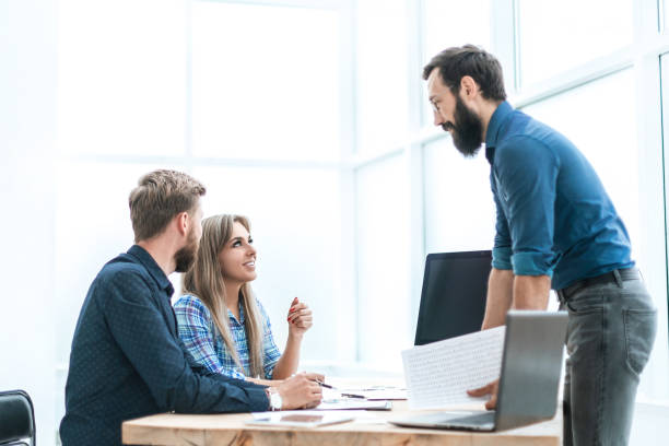 istock client by asking questions to the Bank employee. 1203369413