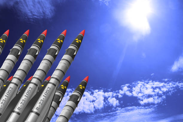 istock Atomic rockets earth - air directed up against a bright sky with white clouds. The concept of atomic warfare. 1203370481