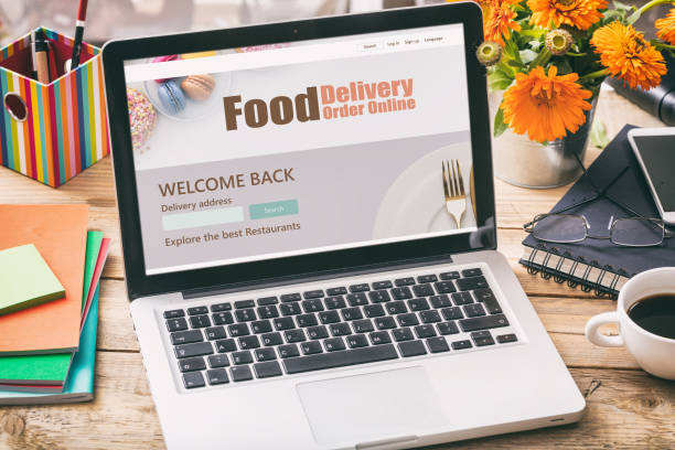 istock Food delivery order online app on computer display, blur office background 1203370547