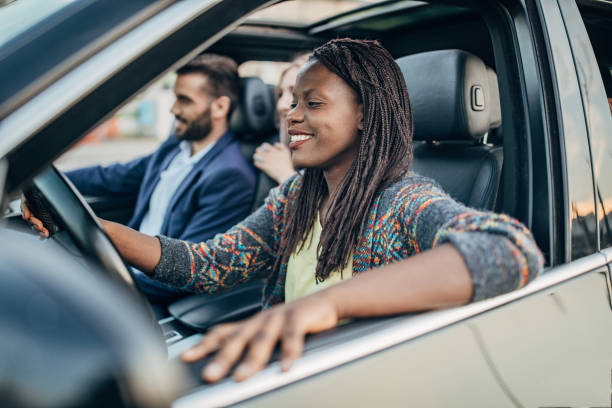 istock Friends traveling by a car 1203371693