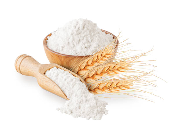 istock Whole grain wheat flour and ears isolated on white 1203373348