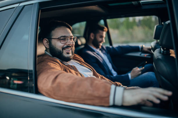 istock Two men are driving in a car 1203374300