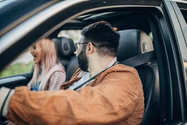istock Friends traveling by a car 1203374929