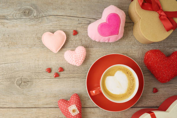 istock Valentines day background with heart shapes, coffee cup and  gift boxes. 1203375874