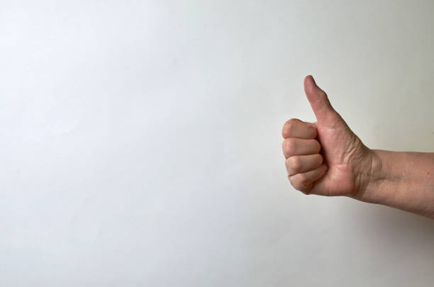 istock Thumb female right hand up on a white background. Compliment, approval, cool. Like.Place for text 1203375951