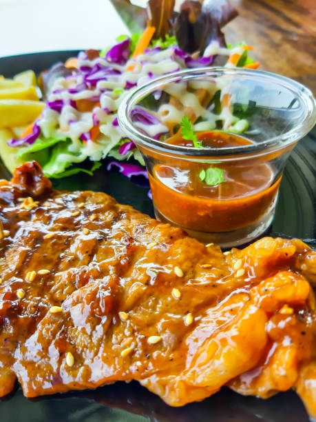 istock Grilled Chicken Steak with BBQ Sauce, with Salad 1203375999